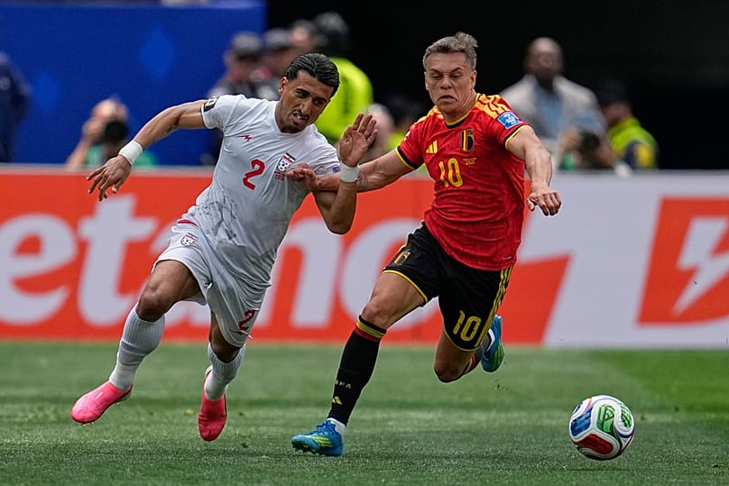 Iran's Saleh Hardani fights for the ball with Belgium's Leandro Trossard during the World Cup Group G match in Inglewood, California, near Los Angeles, Sunday, June 21, 2026
