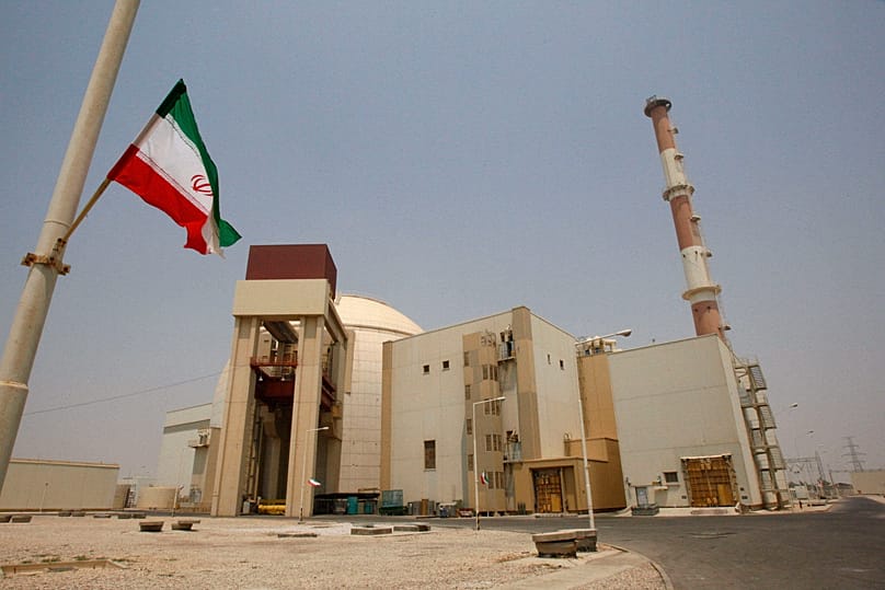 FILE: An Iranian flag flutters in front of the reactor building of the Bushehr nuclear power plant, just outside the southern city of Bushehr, 21 August 2010