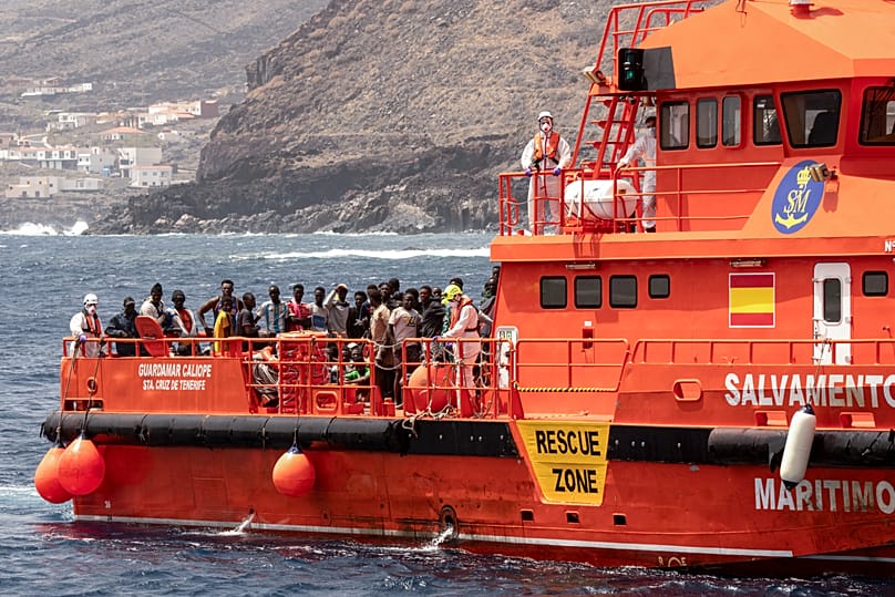 Migrants disembark at the port of on 