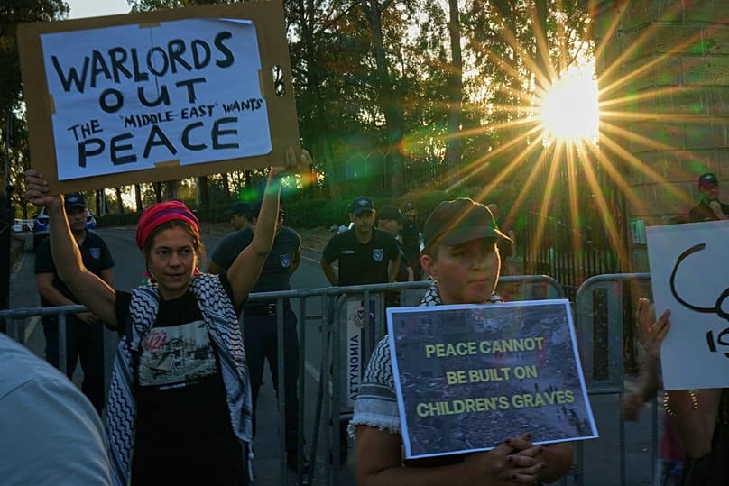 Protesters hold placards during a protest against the Board of Peace in Nicosia, 30 June, 2026