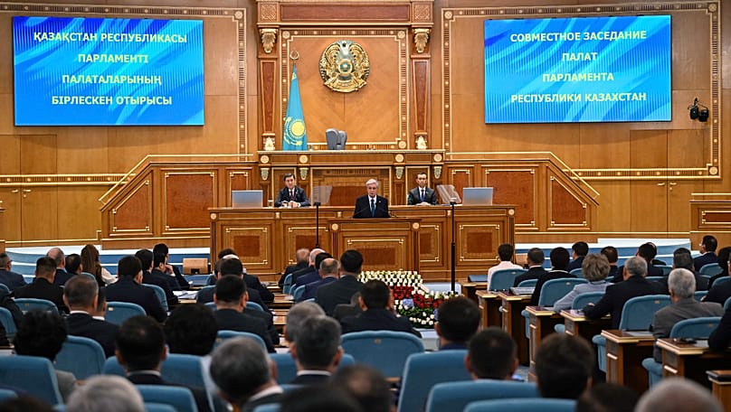 President Tokayev speaking at the last joint session of the two chambers of old parliament.