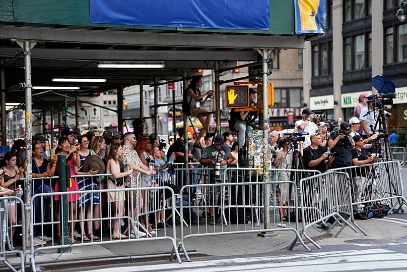 Fans and press gather outside Madison Square Garden ahead of a reported wedding between Taylor Swift and Travis Kelce on Friday, July 3, 2026, in New York.