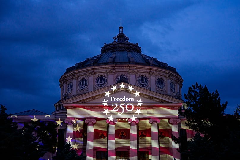 The U.S flag is projected on the facade of the Romanian Athenaeum, a 19th century built concert hall, ahead of United States Independence Day, in Bucharest, Romania, Friday.