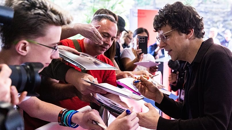 Actor and director Jesse Eisenberg stops to sign fans autographs before receiving the President's Award at Karlovy Vary film festival, 2 July 2026