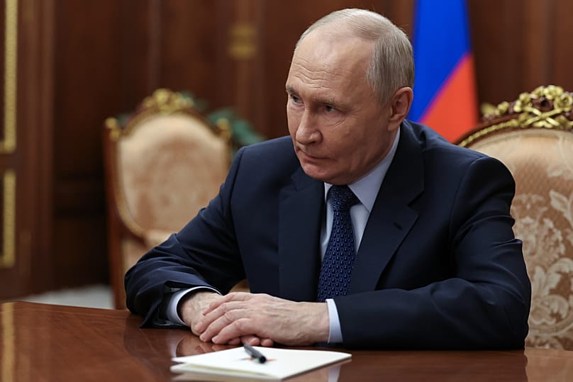 Russian President Vladimir Putin listens to President and Chairman of the Management Board of VTB Bank Andrey Kostin at the Kremlin in Moscow, Friday, July 3, 2026.