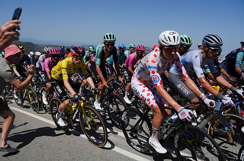 Slovenia's Tadej Pogacar, wearing the best climber's dotted jersey, rides during the second stage of the Tour de France, 5 July, 2026