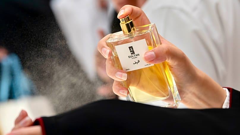 A visitor samples a perfume at Teeb Al Hazm in Doha.