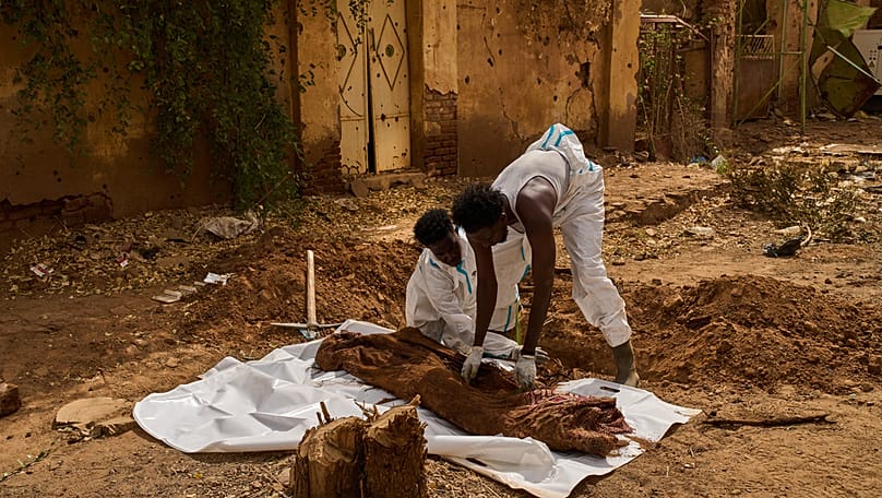 Medics exhume the body of Mohammed Alsawi, 73, who was killed in 2023 by the RSF, in Omdurman, on the outskirts of Khartoum, Sudan, Monday, April 20, 2026