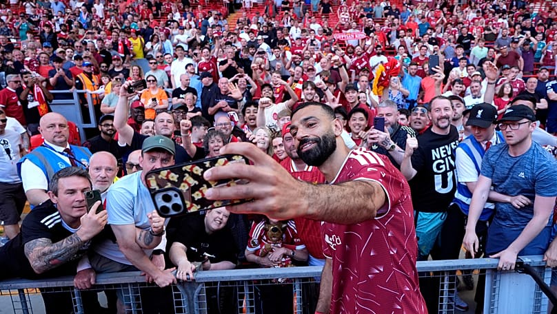 Liverpool's Mohamed Salah takes a selfie with fans following his final club appearance, 24 May 2026
