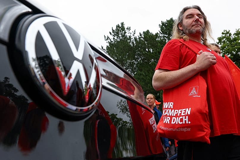 Workers stage a protest outside the Volkswagen plant in Zwickau, 9 July, 2026