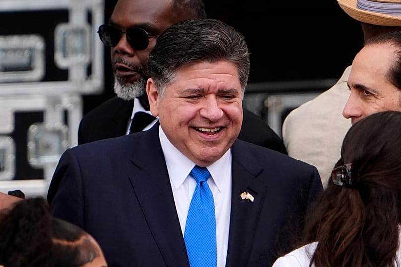 Illinois Gov. JB Pritzker mingles ahead of the Obama Presidential Center dedication ceremony June 18, 2026, in Chicago. (AP Photo/Jeff Roberson,File)