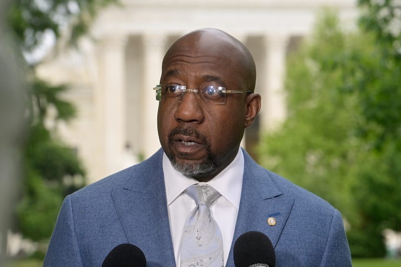 Sen. Raphael Warnock holds a news conference regarding the Supreme Court Voting Rights decision April 29, 2026, in Washington. (AP Photo/Rod Lamkey Jr.)