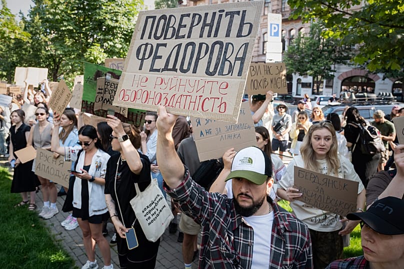 Ukranians gather to denounce Zelenskyy's decision to dismiss Mykhailo Fedorov. Placard reads: Bring back Fedorov. Do not destroy defence capability.  July 16, 2026.