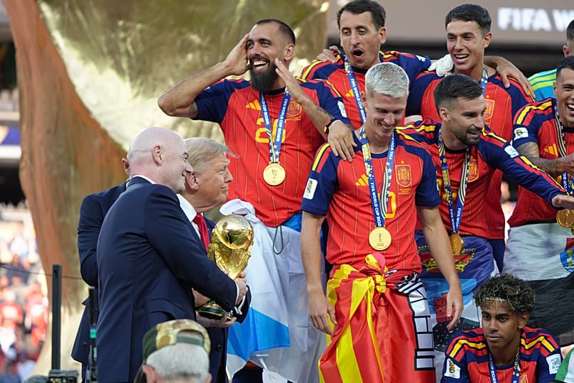 Trump presenting the trophy to the winners