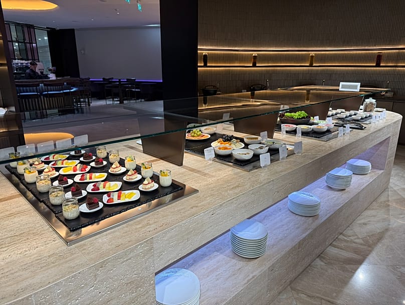 The social dining area offers a classic lounge buffet