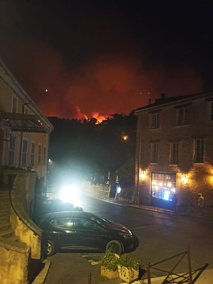 Fire nears the outskirts of the village of Pontignac, in Provence, south of France, 21 July 2026