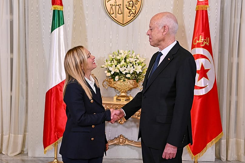 Tunisian President Kais Saied, right, shakes hands with Italian Prime Minister Giorgia Meloni at the Carthage presidential palace in Tunis, Tunisia, Tuesday 6 June 2023.  