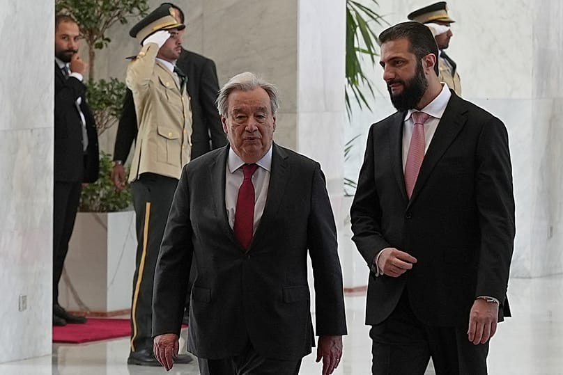 Syrian President Ahmad al-Sharaa walks with United Nations Secretary General Antonio Guterres, at the Syrian presidential palace in Damascus, Syria, Saturday, July 25, 2026.