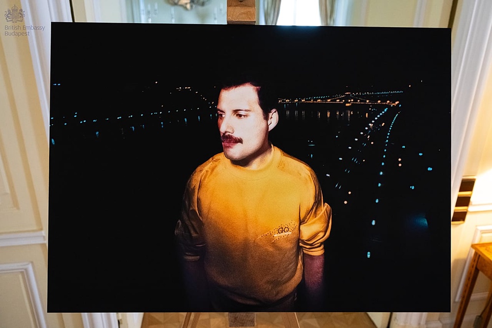 The lights of Budapest shining behind Freddie Mercury