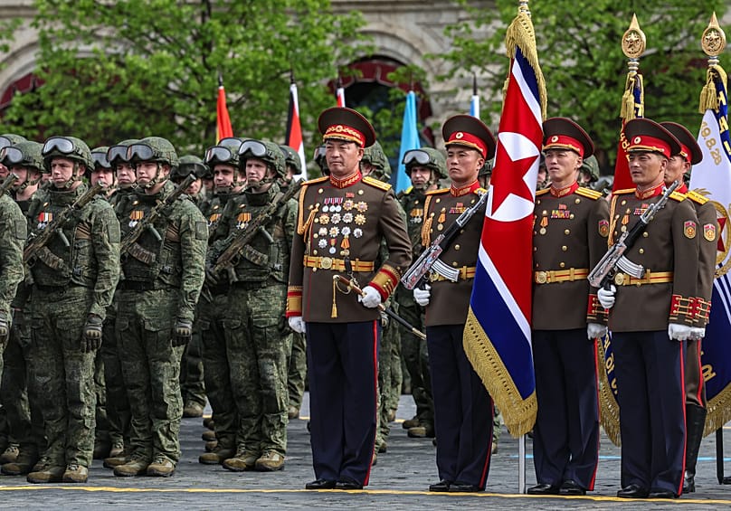 Russian, left, and North Korea's servicemen attend the Victory Day military parade in Moscow, Saturday, May 9, 2026.
