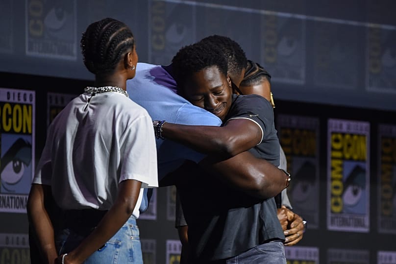 Winston Duke and David Jonsson hugging it out