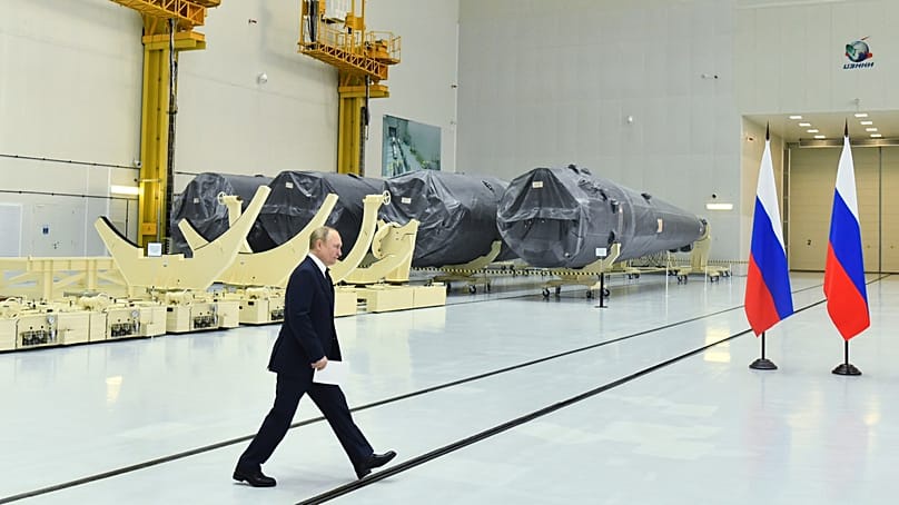 Russian President Vladimir Putin walks at a rocket assembly factory outside the city of Tsiolkovsky, Russia, Tuesday, 12 April, 2022. 