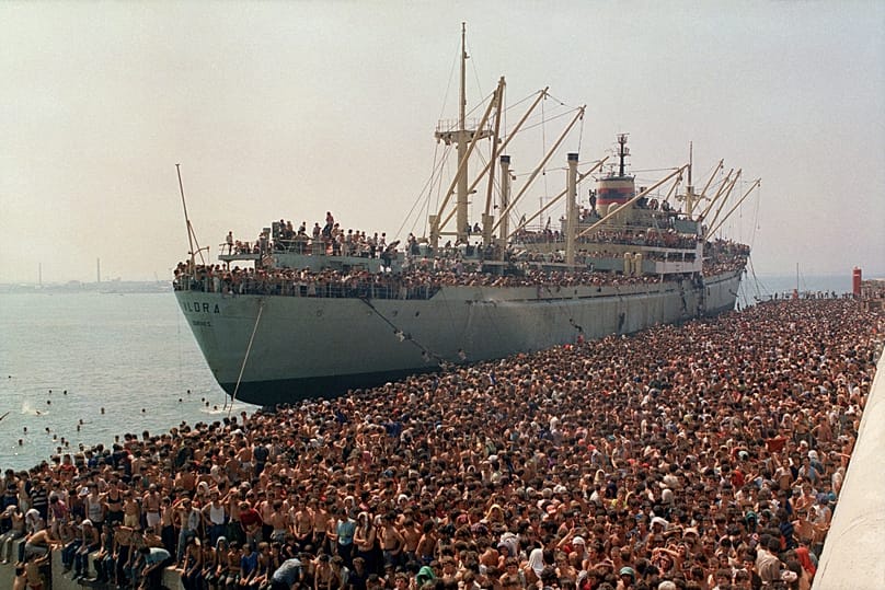 Thousands of Albanians, fleeing starvation in their impoverished homeland and seeking asylum in Italy, crowd the dock in Bari, Italy, Aug. 8, 1991,