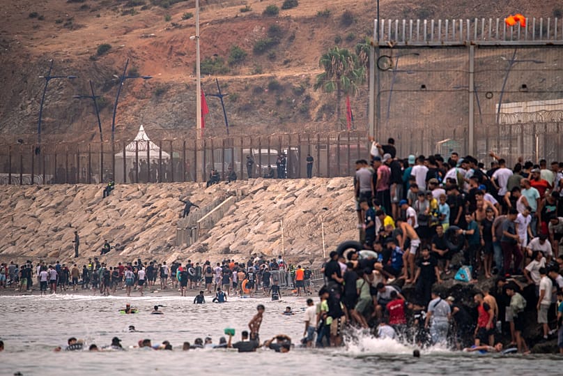 Migrants return to Morocco from the Spanish enclave of Ceuta, Friday 31 July 2026. (AP Photo/Antonio Sempere)