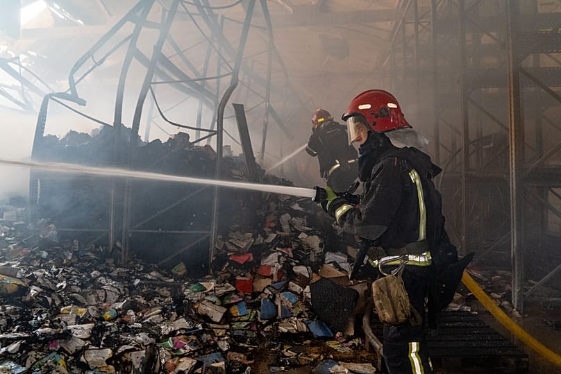 Firefighters put out a fire at a major book warehouse following Russian drone strikes in Kharkiv, 1 August, 2026