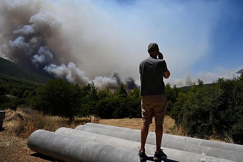 Smoke billows from a wildfire approaching Krio Pigadi near Porto Germeno, northwest of Athens, Greece, Saturday, 1 August 2026
