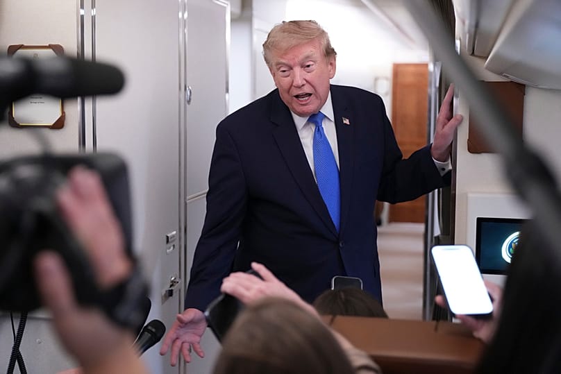 US President Donald Trump speaks to reporters onboard Air Force One while returning to the White House, 2 August, 2026