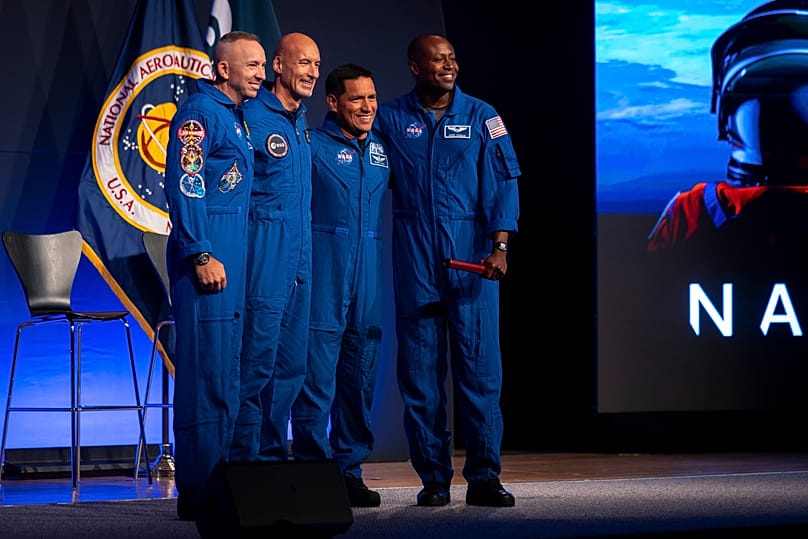 Artemis III crew members Randy Bresnik, Luca Parmitano, Frank Rubio and Andre Douglas pose during a press conference at Johnson Space Center on June 9, 2026, in Houston.