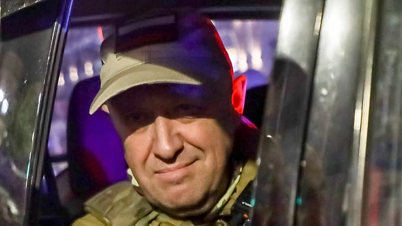 FILE - Yevgeny Prigozhin, the owner of the Wagner Group military company, looks from a military vehicle leaving an area of the HQ of the Southern Military District in a street