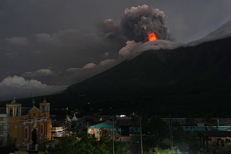 Lava flows out of the crater of the Fuego Volcano as seen from San Juan Alotenango, 4 August, 2026