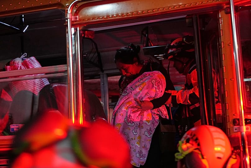 Families evacuated from areas surrounding the Fuego Volcano rest at a temporary shelter in San Juan Alotenango, 4 August, 2026