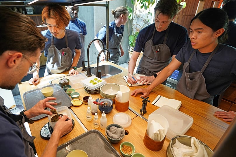 Chefs busily practice making dishes in fine-dining restaurant Noma's kitchen ahead of its new season in Copenhagen, Denmark Tuesday, July 28, 2026. (AP Photo/James Brooks)