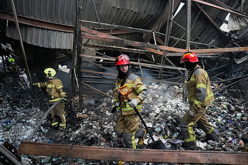 Firefighters put out a fire after Russian missiles hit a warehouse in Kyiv, 5 August, 2026