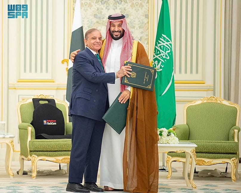 FILE - This handout photograph released by the state-run Saudi Press Agency shows Pakistani Prime Minister Shehbaz Sharif, left, embracing Saudi Arabia's Crown Prince Mohammed