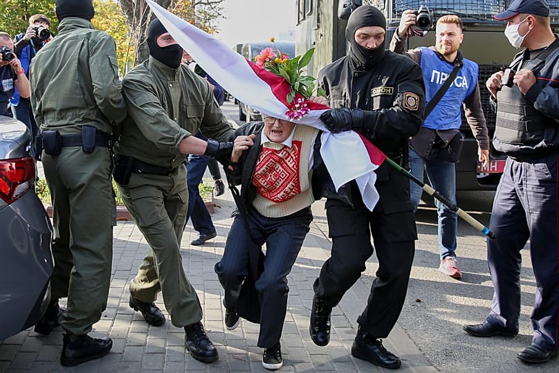 FILEL: Police officers detain Nina Bahinskaya, 73, during an opposition rally to protest the official presidential election results in Minsk, Belarus, Sept. 19, 2020. 