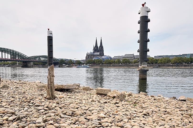 The usually heavily trafficked river Rhine is empty due to low water levels during a prolonged drought, by the Cologne Cathedral in Cologne, Germany, Monday, 5 August 2026.