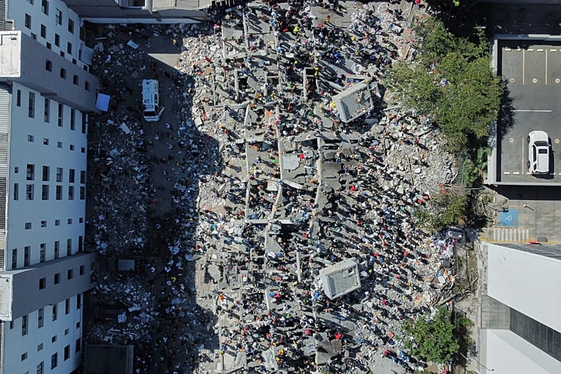 Rescue workers and residents search through the rubble after an earthquake struck Cali, 10 August, 2026