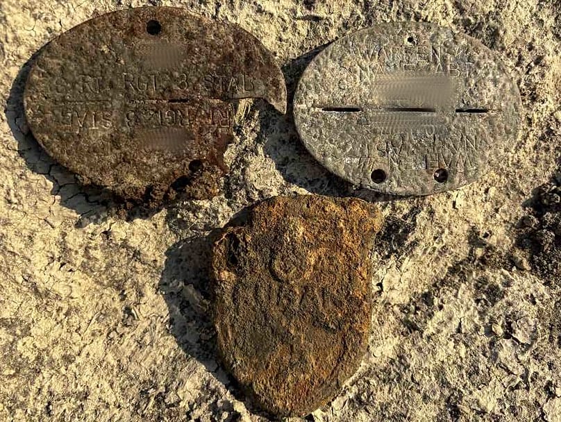 Two identity discs and a Kuban sleeve shield were found on the bodies.