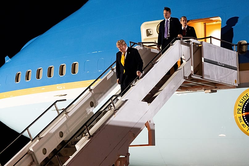 Trump walks from the legacy Air Force One at U.S. Air Force Base, RAF Mildenhall in Suffolk Eastern England, as he switches planes from the NATO summit in Ankara, Turkey, Wedn