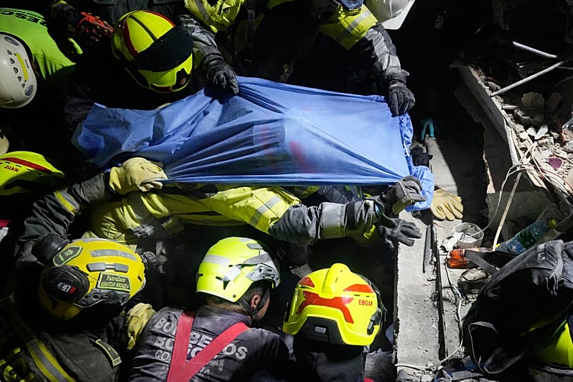 Rescue workers pull a survivor Daniela Largo from the rubble the day after an earthquake struck Pereira, Colombia, Tuesday, 11 August 2026. 