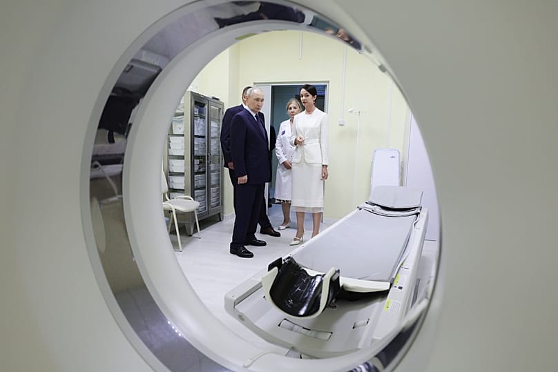 Russian President Vladimir Putin visits the central district hospital at Kitovoye village on Iturup, the largest of the disputed Kuril Islands, on Thursday, Aug. 13, 2026