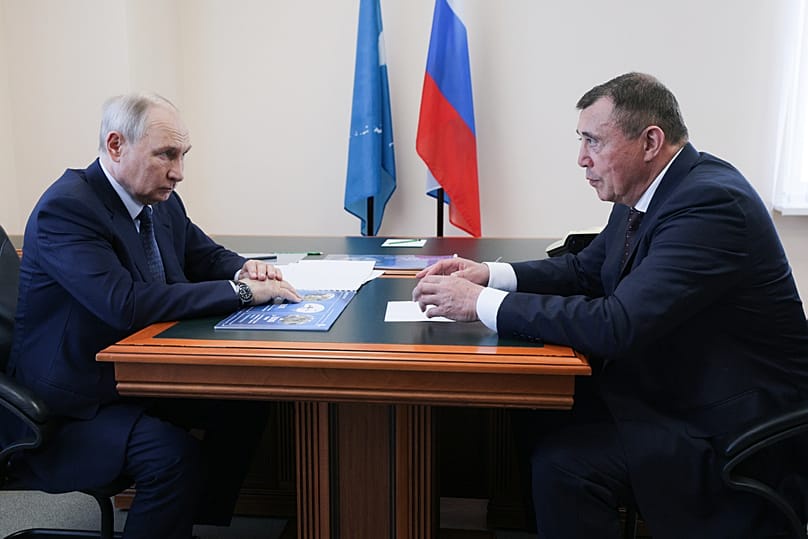 Vladimir Putin listens to Sakhalin Region Governor Valery Limarenko in Kurilsk on Iturup, the largest of the disputed Kuril Islands, on Thursday, Aug. 13, 2026