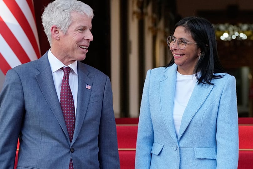FILE. Venezuela's acting President Delcy Rodriguez bids farewell to US Energy Secretary Chris Wright after their meeting at Miraflores Palace in Caracas, 11 Feb. 2026