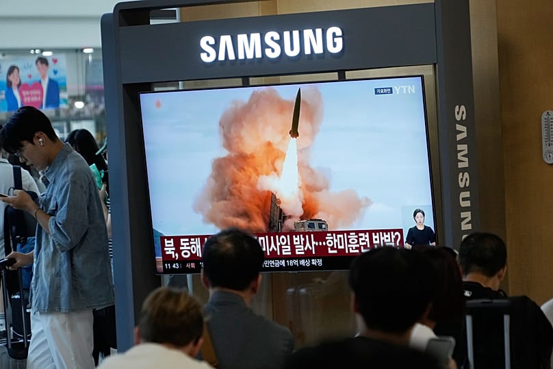 A TV screen shows a file image of North Korea's missile launch during a news program at Seoul Railway Station in Seoul, South Korea, Wednesday, Aug. 12, 2026