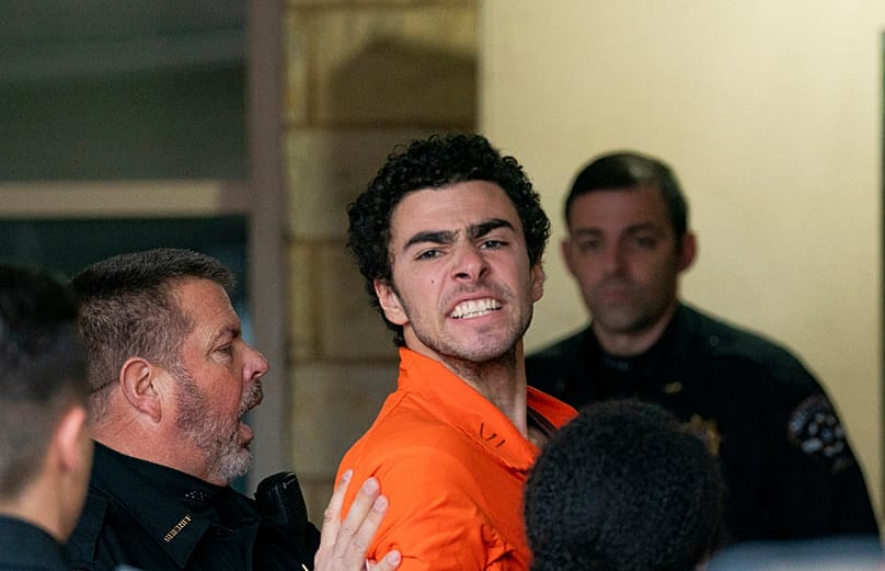 FILE - Suspect Luigi Mangione is taken into the Blair County Courthouse on Tuesday, Dec. 10, 2024, in Hollidaysburg, Pennsylvania