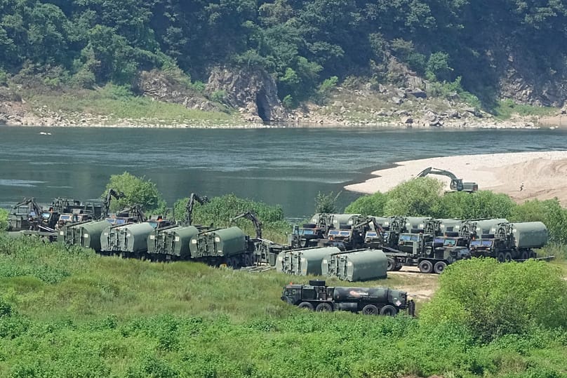 The US Army's armoured vehicles gather to cross a river at a training field in Yeoncheon, 18 August, 2026